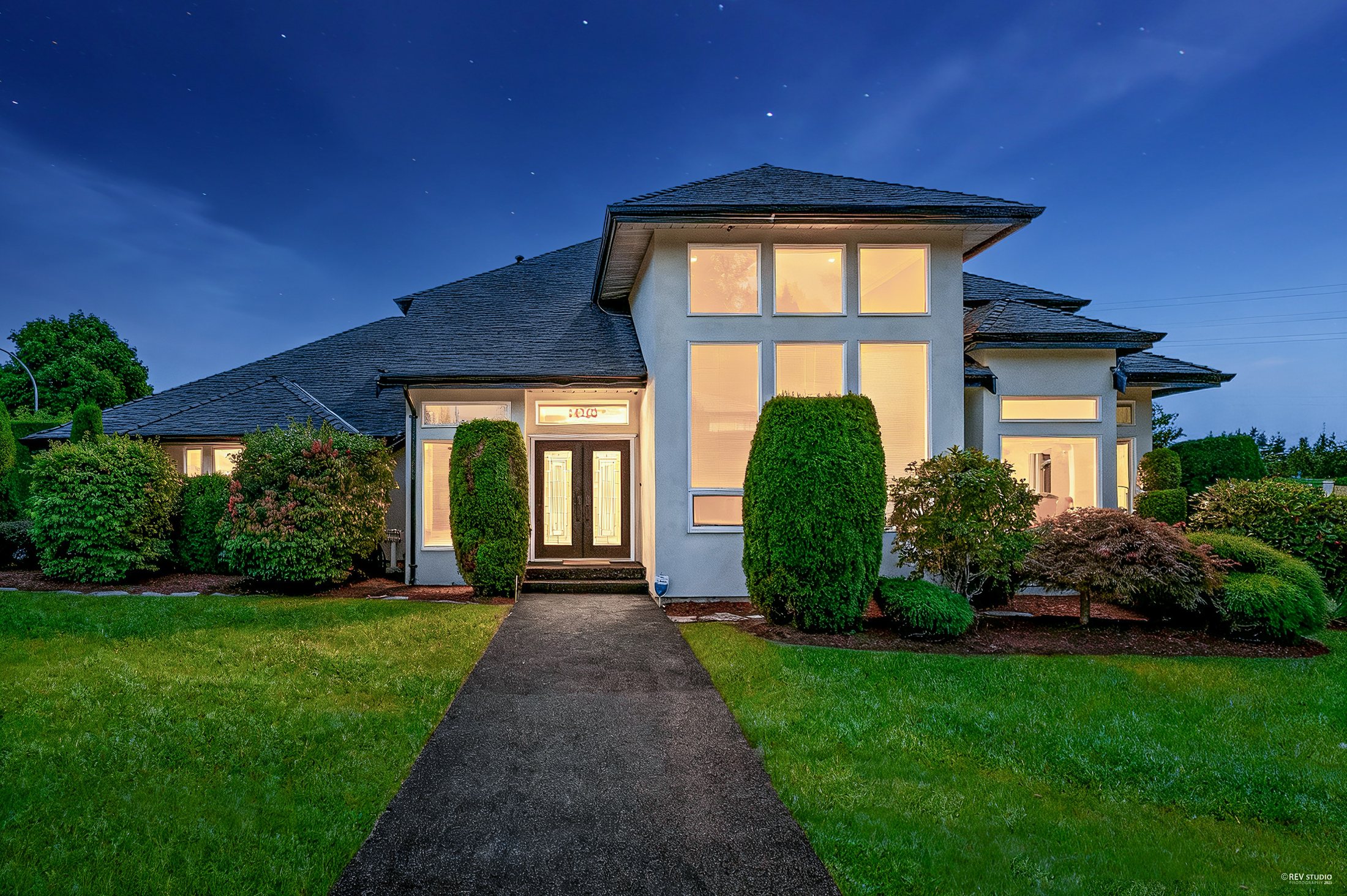 Estate home at twilight, South Surrey